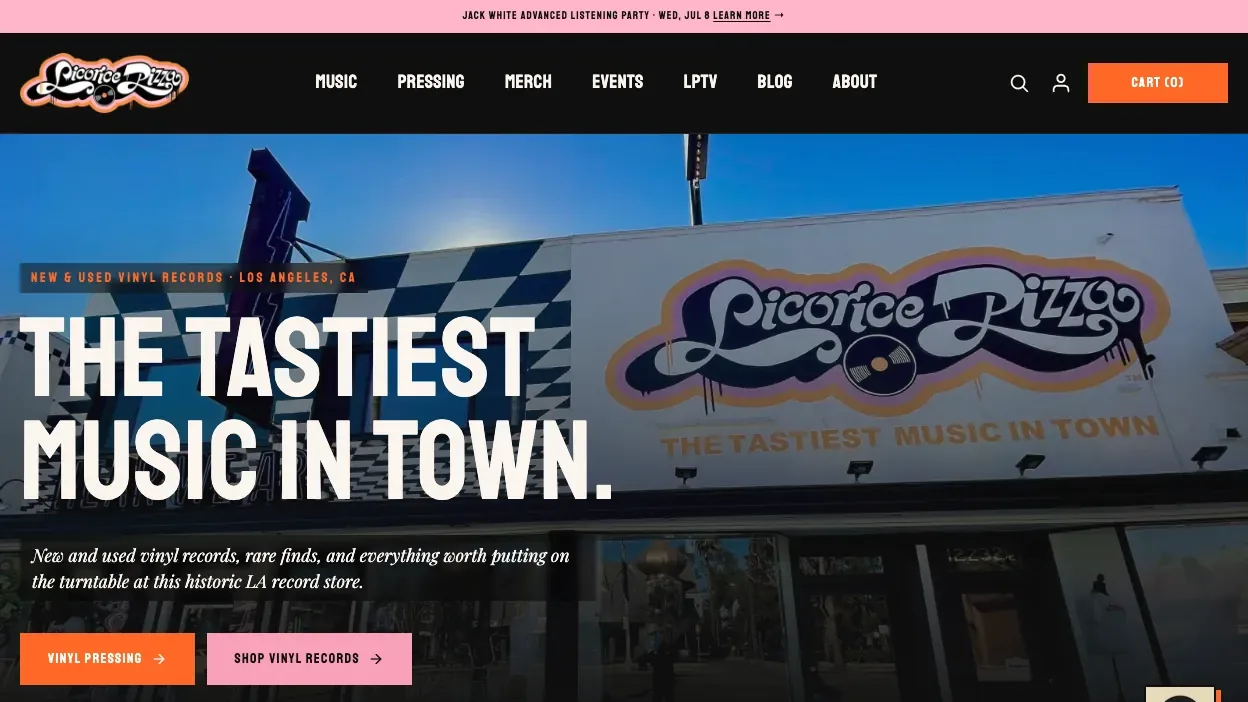 The rebuilt homepage: a photograph of the store's rooftop sign under the headline The Tastiest Music In Town, with buttons for vinyl pressing and shopping records.
